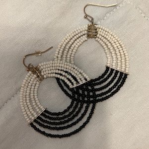 Black and White beaded dangle earrings with gold colored hardware